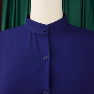 Close-up of stand-up collar and single-breasted buttons on dark blue summer dress