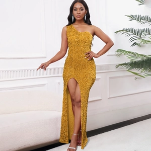 Detail of shimmering gold sequin evening dress with one-shoulder cut and high leg slit
