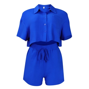 Detailed macro view of royal blue short sleeve shirt and drawstring shorts set texture