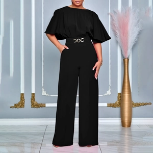 Detail of high waist black wide leg jumpsuit with an elegant gold triple ring belt