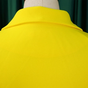 Close-up of the high-quality stitching on the collar of this yellow business blazer
