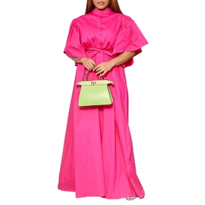 Detailed view of Barbie pink maxi dress featuring flare sleeves and a belted waistline
