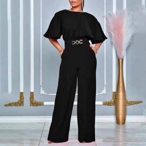 Detail of elegant black wide-leg jumpsuit with ruffled sleeves and gold interlocking belt
