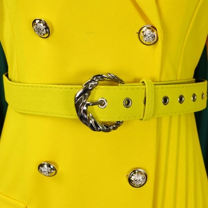 Detailed shot of yellow blazer dress featuring lion head buttons and pleated skirt detail