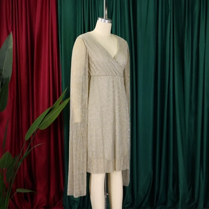Detail of elegant V-neck champagne pleated evening dress with draped cape style long sleeves