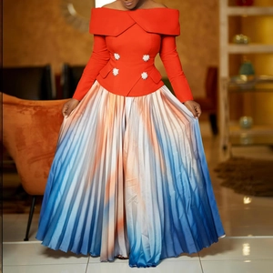 Close-up of elegant off-shoulder orange top featuring four white decorative flower buttons