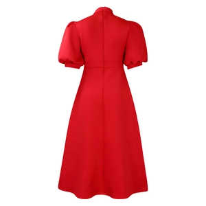 Detailed back view of red puff sleeve evening dress with concealed zipper and pleated waist