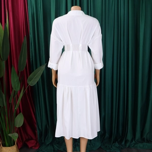 Back view of white long sleeve shirt dress with pleated hem and waist belt detailing