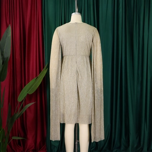 Rear view of gold pleated evening dress featuring elegant cape sleeves and hidden zipper