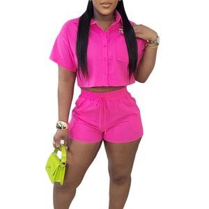 Hot pink two-piece casual set with button-down collar shirt and elastic drawstring shorts