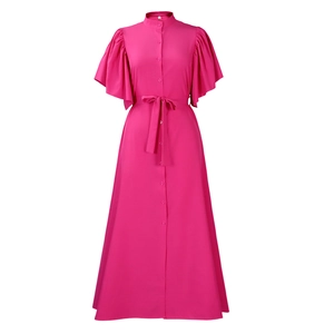 Detail of rose red shirt dress featuring stand collar buttons and pleated butterfly sleeves