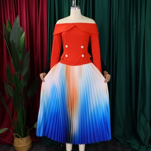 Detail of off-shoulder top with pearl buttons and pleated three-color gradient long skirt