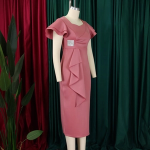 Detail of the elegant lotus leaf sleeve and sparkling silver waist buckle on the pink dress