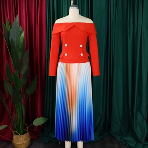 Detail of off-shoulder top with pearl buttons and vibrant gradient pleated maxi skirt