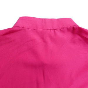 Detail of rose red dress collar with premium stitching and high quality fabric texture