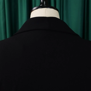 Close-up of the black blazer dress rear collar showing the fine textured worsted fabric