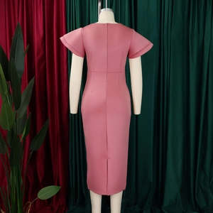 Detail view of pink ruffle sleeve sheath dress featuring back slit and zipper closure