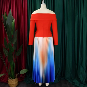 Close-up of elegant off-shoulder red top with gradient pleated maxi skirt