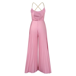 Macro shot of gold chain neck straps and pleated fabric detail on pink jumpsuit