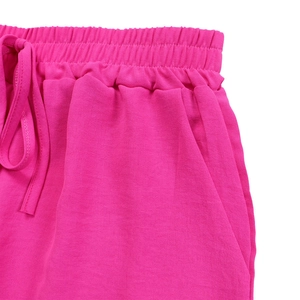 Detailed macro view of the rose red high waist elastic shorts with adjustable drawstring