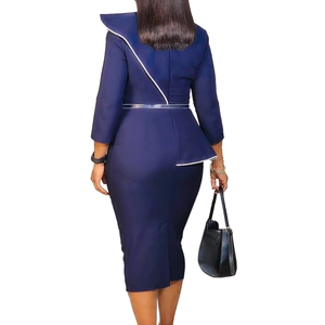 Detail view showing the back profile of the elegant dark blue pencil dress with white trim