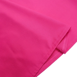Close-up of double-stitched hem on a rose red summer dress with fine fabric texture