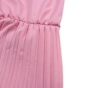 Detail of pink wide-leg jumpsuit showing elastic waist and pleated fabric texture