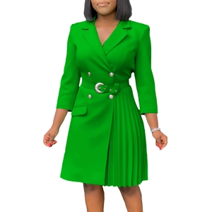 Detail of green double-breasted blazer dress with pleated hem and belted waist