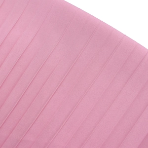 Detailed macro shot of pink pleated fabric texture with fine vertical weave craftsmanship