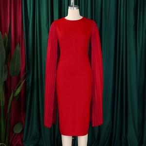 Detail of red pleated cape sleeves and elegant crew neck on a slim-fit evening dress