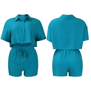Detail of teal summer two-piece set featuring short sleeve shirt and drawstring shorts