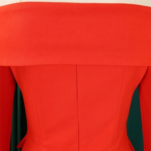 Detail of red off-shoulder top showing back seam construction and textured fabric