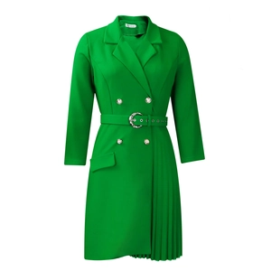 Detail of green blazer dress with metal woven belt buckle and pleated asymmetrical hem