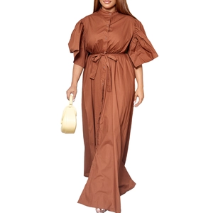 Detail of a brown maxi shirt dress with flare sleeves and a waist belt in high quality