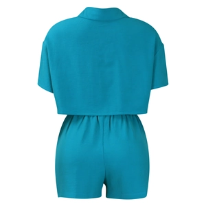 Rear view of women's cyan blue two-piece casual set with crop top and high waist shorts