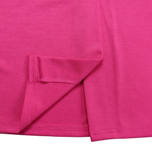 Close-up of the split hem and fine stitching on this rose red knitted pencil dress