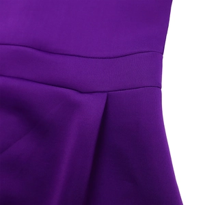 Detailed macro view showing the pleated waistline and stitching on the purple party dress