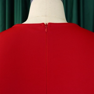 Detail shot of the red evening dress showing the high-quality invisible back zipper