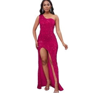 Close-up of shimmering rose pink sequins and high slit detail on a one-shoulder gown