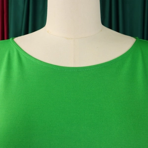 Close-up of vibrant green round neckline with premium double-needle stitching detail