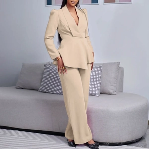 Detailed view of women's blazer set with ruffled waist design and wide-leg trousers
