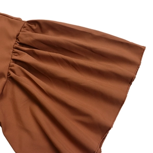Detail of flared ruffle sleeve with gathered pleats on caramel summer midi dress