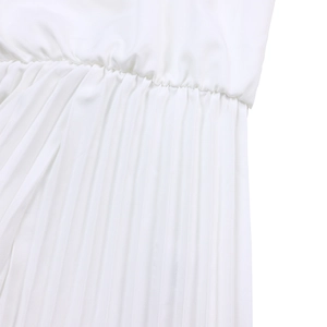 Detailed view of white pleated fabric with elastic waist and high-quality pleating design