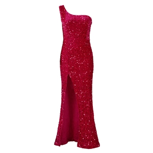 Detailed view of magenta sequins on a one-shoulder formal dress with high side slit