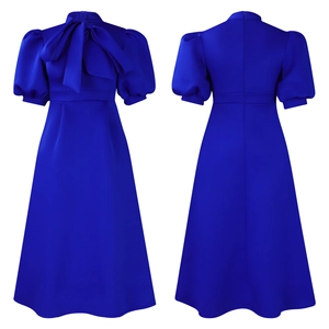 Front and back view of royal blue puff sleeve dress with a large bow neckline detail