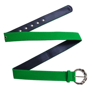 Detail showing green faux suede belt with silver textured round buckle and metal eyelets