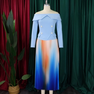 Detail of off-shoulder top with pearl buttons and a pleated gradient long skirt