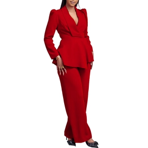Detail view of red women's two-piece suit set with V-neck peplum top and wide leg pants