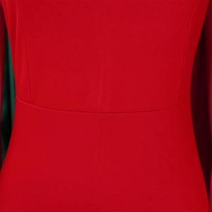 Detailed macro shot of red evening dress fabric showing fine texture and sewing seams