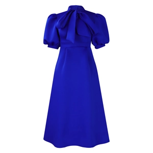 Close-up of royal blue elegant dress featuring bow-tie stand collar and puff sleeves
